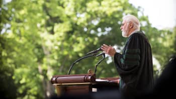 William Foege in profile at the podium at Emory's 2016 Commencement